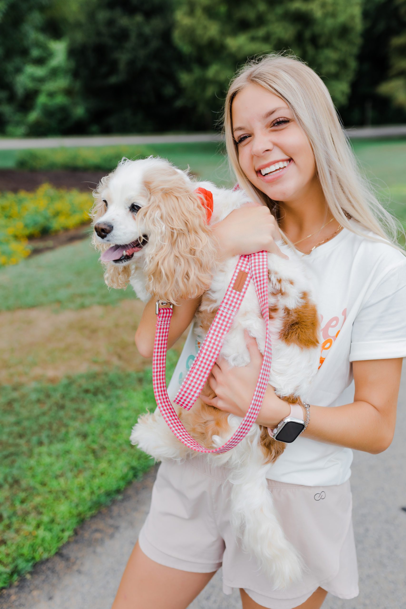young woman at a park with her dog for brand photography in Augusta Georgia